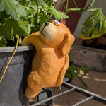 Hanging dog pot hanger resin figurine gripping edge of garden pot — orange climbing dog garden decor