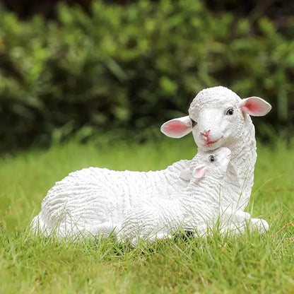White lamb sculpture on grass with blurred green background