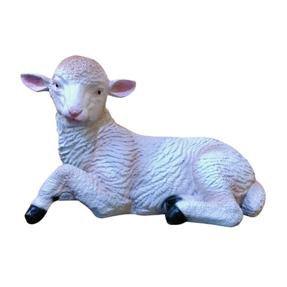 White sheep figurine on a white background