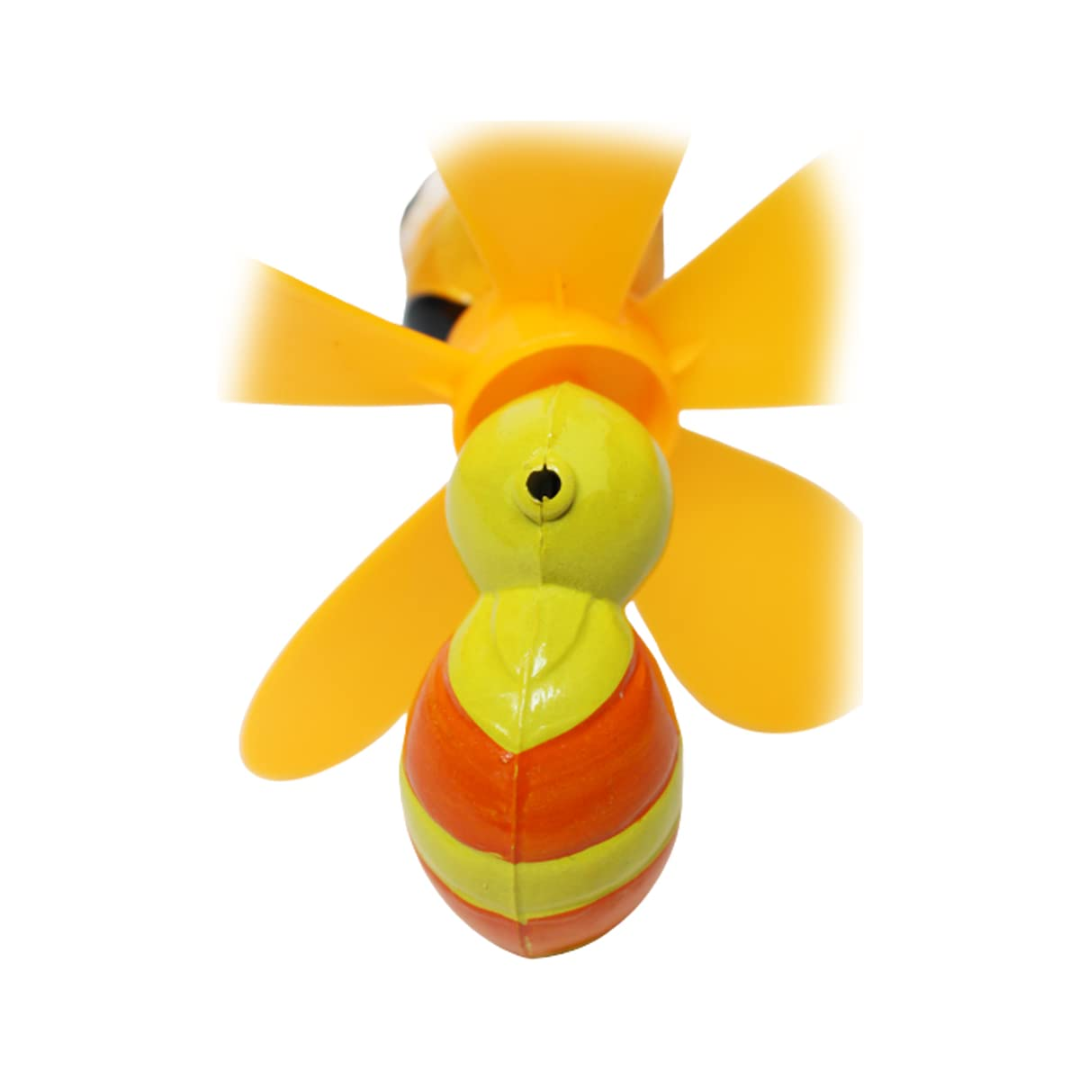 Toy bee with yellow and orange body on a white background