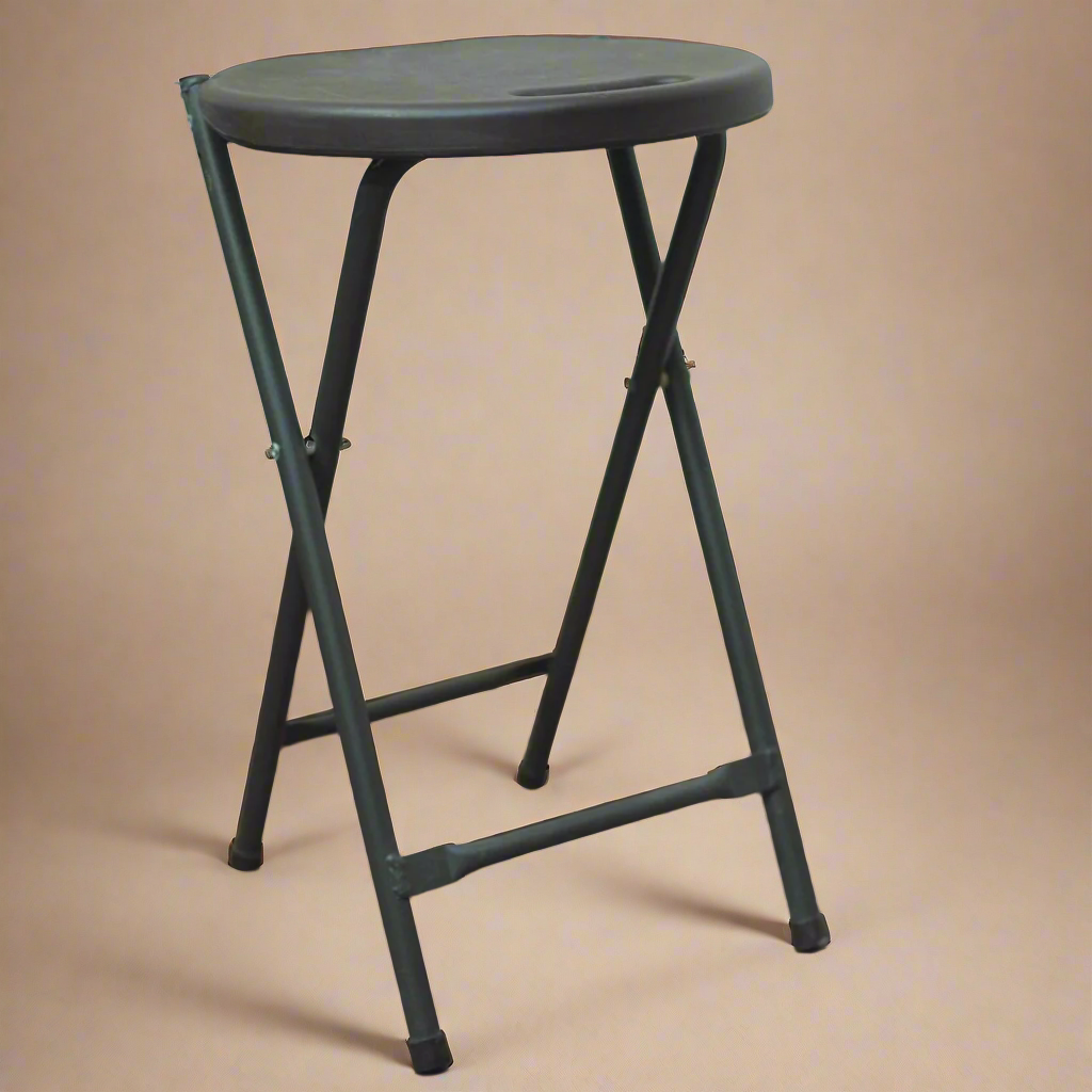 Black metal folding stool on a wooden floor with a textured wall background