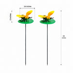 Two garden stake decorations shaped like yellow and orange ladybugs on round green bases, shown with dimension callouts for height, width, and total stake length on a white background.