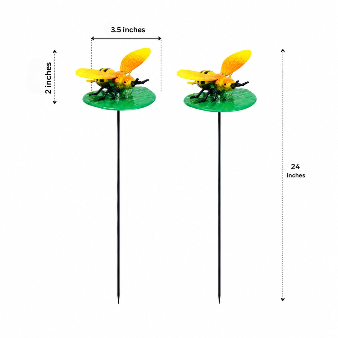 Two garden stake decorations shaped like yellow and orange ladybugs on round green bases, shown with dimension callouts for height, width, and total stake length on a white background.