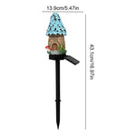 A solar-powered garden stake with a small fairy house ornament on top, shown with dimension lines and measurements: 13.9cm/5.