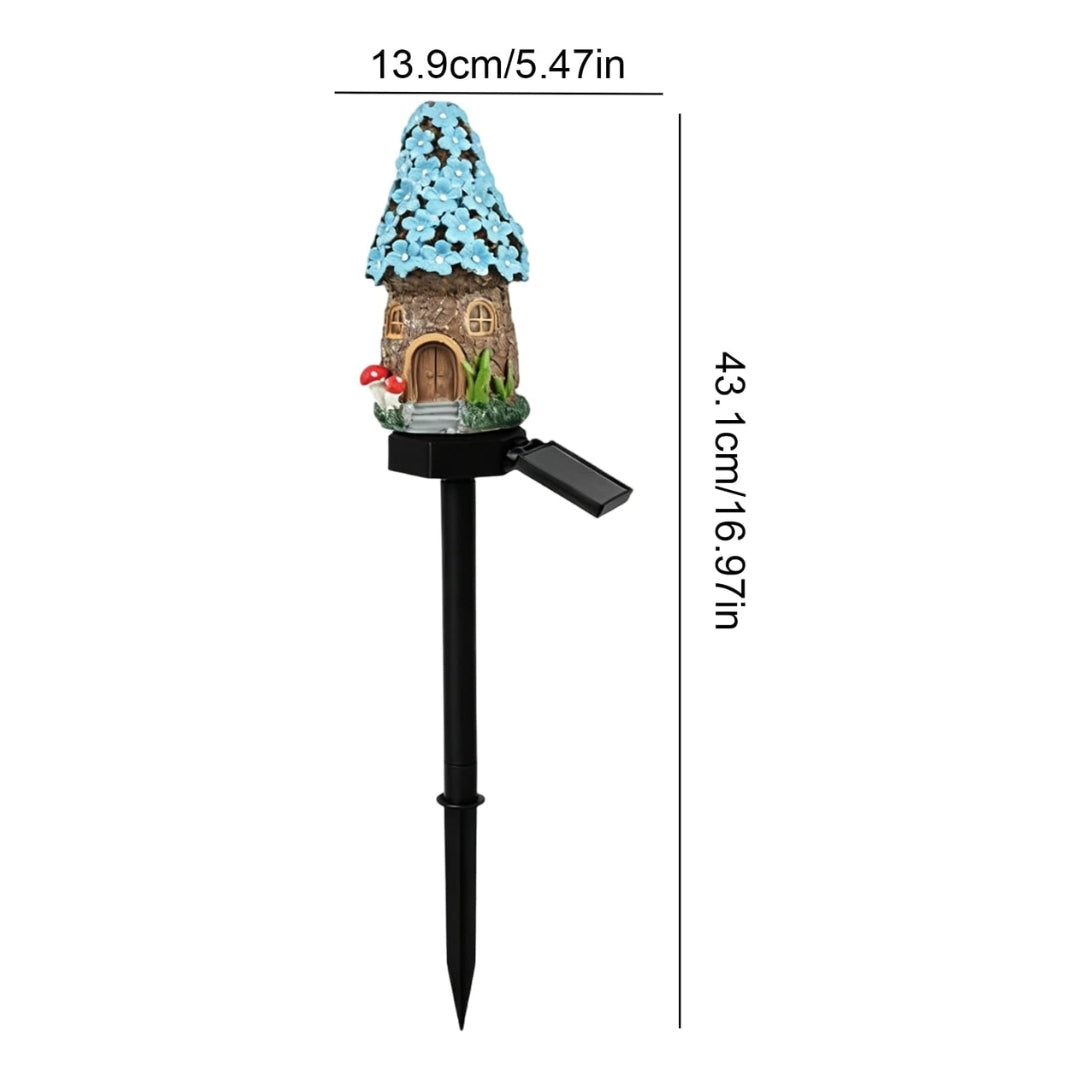 A solar-powered garden stake with a small fairy house ornament on top, shown with dimension lines and measurements: 13.9cm/5.