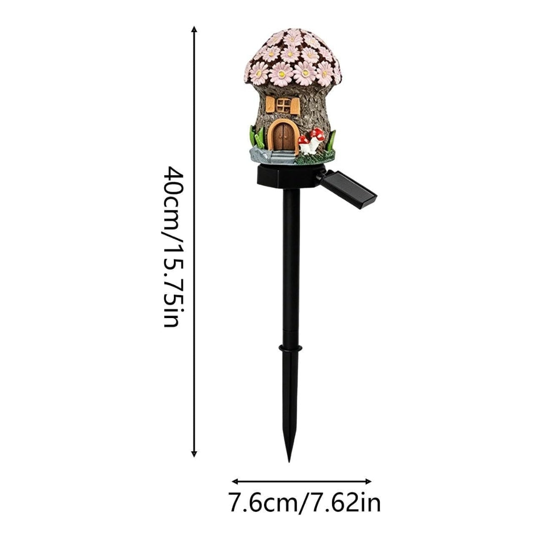 A solar garden stake with a mushroom-shaped decorative house on top, shown with dimension lines indicating a height of 40cm (15.75in) and a stake length of 7.