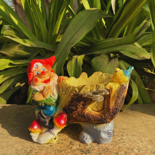 Whimsical garden gnome planter in multicolor, crafted from durable resin, perfect for outdoor garden decor and home entrances. A unique decorative planter pot featuring a cheerful gnome and bird, ideal for housewarming gifts and floral displays.