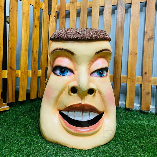 Multicolor face-shaped stool by The Decorshed, crafted from durable resin, perfect for quirky home decor, modern seating, or a decorative side table for indoor and outdoor use.