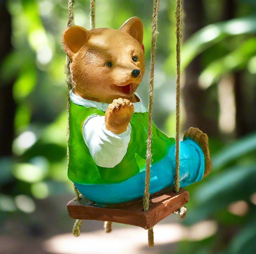 Swinging Bear features a handcrafted resin bear on a swing, perfect as a whimsical bear planter for garden animal-themed decor, outdoor hanging planter, or indoor decorative swing planter.