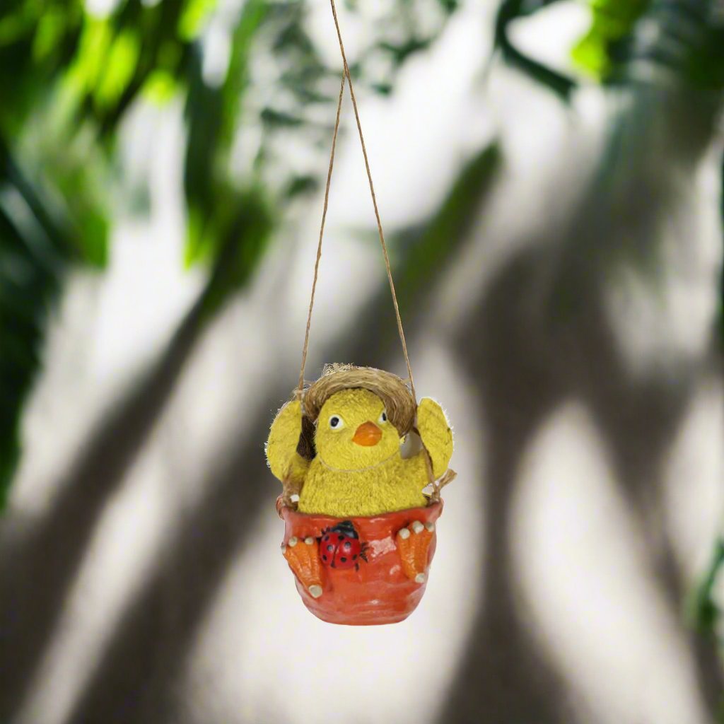 Adorable Swinging Chick Planter featuring a handcrafted chick on a swing, perfect as a whimsical garden decoration or hanging planter for succulents or herbs, ideal for indoor and outdoor spaces.